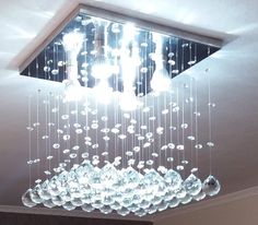 a chandelier hanging from the ceiling in a room