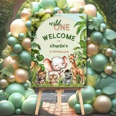 a welcome sign surrounded by balloons and greenery for a children's birthday party