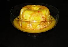 a glass bowl filled with food on top of a table