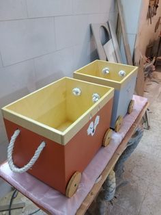 two wooden boxes sitting on top of a table