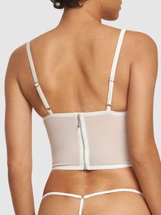 Adjustable spaghetti straps. Back hook closures. Underwire. Front lace-up detail. Front cutout detail. All over pattern placement may vary. Model is wearing a sizeS White Corset With Built-in Bra And Tank Straps, Fitted Cami Corset With Built-in Bra, Fitted Lace Tank Top With Straps, Fitted Lace Tank Top With Adjustable Straps, Lace Tank Top With Adjustable Straps, Party Camisole With Removable Bra Pads And Spaghetti Straps, White Fitted Bra With Spaghetti Straps, Fitted Corset With Built-in Bra And Spaghetti Straps, White Camisole Corset With Straps