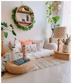 a living room filled with lots of furniture and plants on top of the rugs