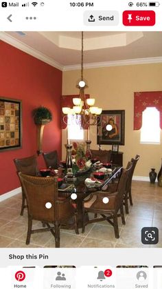 a dining room with red walls and tile flooring