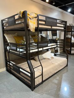 bunk beds are lined up against the wall in a room with carpeted flooring