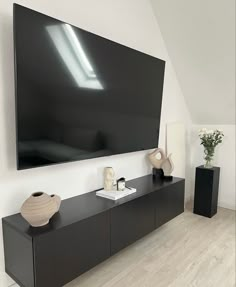 a large flat screen tv mounted to the side of a wall