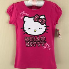 In Pink. Product Features Crewneck Short Sleeves Glitter Bows & "Hello Kitty" Graphics Fabric & Care 100% Cotton Machine Wash Imported Sanrio Shirts, Hello Kitty Shirts, Top Girls, Glitter Bow, Rock Shirts, Pink Shorts, Cat Shirts, Things To Buy, Kids Shirts