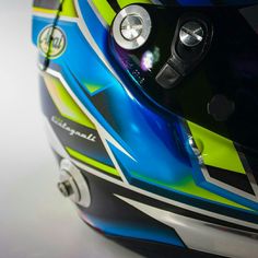 the helmet is designed to look like it has been painted blue, yellow and green