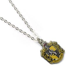 PRICES MAY VARY. The Hufflepuff House Crest Charm Necklace — The Crest of the famous Hogwarts house, founded by Helga Hufflepuff, on a silver plated chain. This Harry Potter Pin Badge has been created using the official style guide from Warner Bros. Helga Hufflepuff, Hufflepuff Crest, Harry Potter Cards, Harry Potter Necklace, Hufflepuff House, Slider Necklace, Harry Potter Jewelry, Harry Potter Pin, Harry Potter Hufflepuff