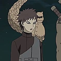 an anime character is standing in the dark with two cats on his shoulders and one cat sitting on his shoulder