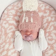 What a cute way to greet the world! This beanie is hand knit in cozy Rosy pink hued yarn with the word 'hi.' in natural colored yarn. Topped with a natural yarn pom pom, this looks great with everything and is a fun gender neutral baby gift.• 100% Acrylic• Cold handwash• Hand knit in China Girls Beanie Hats, Knitted Baby Beanies, Girls Knit Hat, Pink Baby Blanket, Neutral Baby Gifts, Thoughtful Baby Shower Gifts, Gender Neutral Baby Gifts, Newborn Hats, Hand Knit Blanket