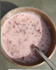 a bowl of food with a spoon in it