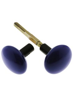 two blue knobs with a gold handle on each one and a screw in the middle