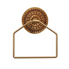 a brass towel ring with an intricate design on the front and back of it's holder