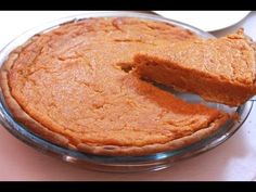 a pie is being cut with a knife