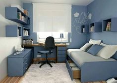 a bedroom with blue walls and white carpeted flooring, built in bookshelves