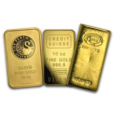 three gold bars are sitting next to each other on a white surface with the words, credit suisse and fine gold