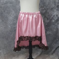 "Lovely Hi-low skirt in Rose Pink Satin with a ruffle trim in Brown Lace. The skirt is a size Medium and has an elastic waist. It will fit waist sizes from 30.5 - 36 inches (76-91.5 cm). The front length is 14.5 inches (37 cm) and back length is 25 inches (63.5 cm). BLOUSE AND WAIST CINCHER ARE NOT INCLUDED. THIS IS A FINISHED ITEM AND WILL SHIP WITHIN 48 HOURS OF COMPLETED PAYMENT. ✿This piece has been handmade entirely by me from design to completion - I do not use any manufacturers in any of Pink Flirty Ruffled Skirt, Feminine Pink Ruffled Skirt, Feminine Pink Skirt With Lace Trim, Pink Ruffled Balletcore Skirt, Pink Satin Skirt, Pink Harajuku Ruffle Skirt, Hi Low Skirts, Natural Linen Dress, Steampunk Corset