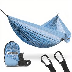 a blue hammock with two black straps and an umbrella attached to the side