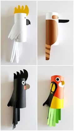 four different types of paper birds hanging on the wall, each with their own face