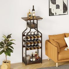 a living room filled with furniture and a wine rack on top of a shelf next to a couch