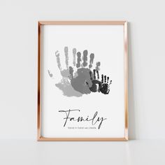 a hand print with the words family in black and white, against a plain background