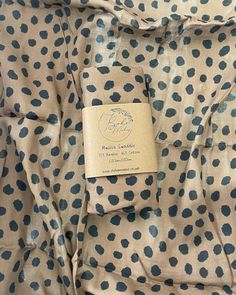 a polka dot fabric with a label on it that says,'the fabric is blue and white