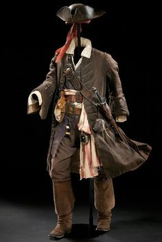 an old fashioned pirate costume on display in a dark room with a black background photo