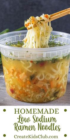 homemade fettuccine noodles in a plastic container with chopsticks sticking out