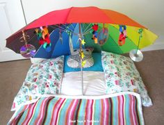 there is an open umbrella on the bed