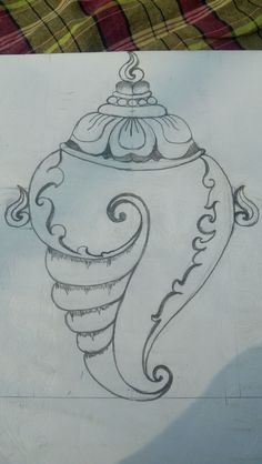 a drawing of an ornate vase on a piece of paper