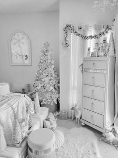 a black and white photo of a bedroom decorated for christmas