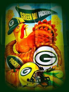 a green bay packers poster on the side of a building with footballs and turkey