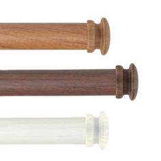 two wooden handles and one white handle are on top of each other in different positions