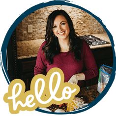 a woman standing in front of a table with food on it and the words hello