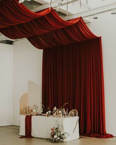 a table is set up with candles, flowers and other decorations for a wedding reception