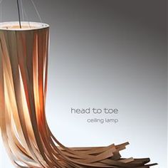 an advertisement for a candle that has been turned into a vase with wood strips in it