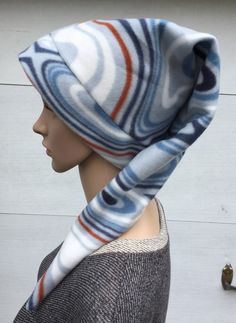 a mannequin wearing a hat and scarf on top of it's head