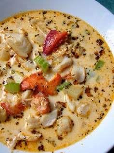 a white bowl filled with soup on top of a table