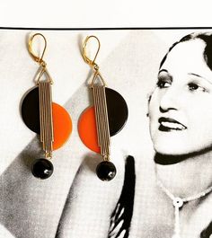 A stunning & unique pair of vintage art deco style earringsfantastic geometric shapeGold tone metal with lovely rich Black  & Orange Tango  phenolic Bakelite with two Czech Glass  drops - look great on ! Earrings are handmade and reworked using true vintage 1930s Bakelite & galalith from my large collection. Each pair of earrings are unique and I will only make limited pairs in each design due to the rarity of vintage Bakelite.after the style of jakob bengel and similiar European Mod Retro Black Round Earrings, Art Deco Earrings Vintage, Deco Earrings, Modernist Jewelry, Vintage Bakelite, Earrings Geometric, Art Deco Earrings, Vintage Orange, Earrings Vintage