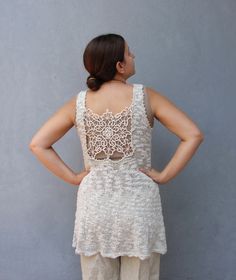 This beautiful knitted summer tunic tank top is soft and comfortable.  It is entirely hand knitted with a light summer yarn, 55% cotton, 40% acrylic and 5% polyamide. The Romanian needle  lace at the back, is in the exact same color as the tunic's yarn making it a perfect fit.  As the lace is vintage this top is a limited edition of 2, truly unique. If you want yours to be made in a different size, please let us know. The tunic is made of a natural breathing material, super comfortable. Size  me Esty Finds, Knitted Tunic, Summer Yarn, Bohemian Top, Amazing Finds, Summer Tunics, Cozy Crochet, Bohemian Tops, Tunic Tank Tops