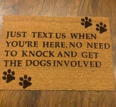 a dog door mat that says just text us when you're here, no need to knock and get the dogs involved