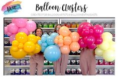 two women holding balloons in front of shelves