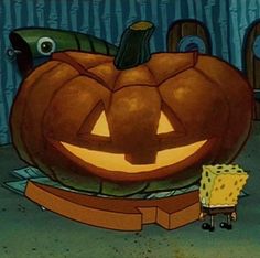 spongebob and his pumpkin in the middle of a room with other items around him