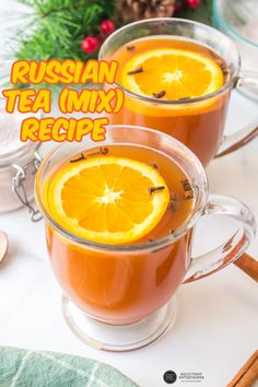 two glasses of russian tea mix with orange slices