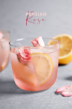 two glasses filled with pink lemonade and rose petals