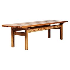 a wooden table sitting on top of a white background