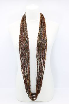 Description: 10-strand necklace Hand Painted 5mm x 6mm wooden beads Necklace Each necklace can be worn in different ways Length:Approximately 140 cmAvailable colours & Product codes:Red NL1966-H04Shades of Grey NL1966-H07Terecotta NL1966-H20Summer Beans NL1966-H57Autumn Beans NL1966-H58