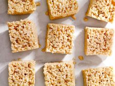 nine squares of rice krispy treats on a white surface