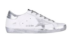 a white and silver sneaker with stars on the side