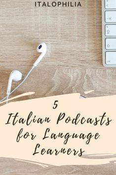 an image of headphones sitting on top of a wooden table with the words italian languages for language learners